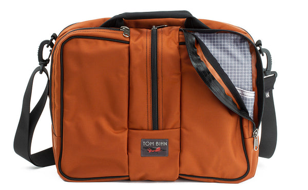 Pilot in Burnt Orange Ballistic with Northwest Sky (light grey with white grid) 200 Halcyon interior.